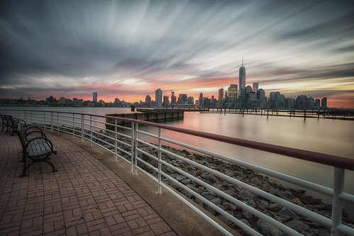 city nyc sky newyork tower water skyline clouds sunrise fence river bench dawn freedom colorful pretty cityscape view sony ngc special hudsonriver wtc hudson 12mm railing lonexposure jersy rokinon jersycity a6000 rokinon12mm ilce6000