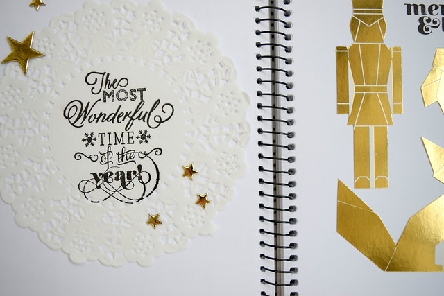 Gold, doily, and black on an art journal page