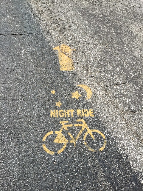 "Night ride" painted on pavement