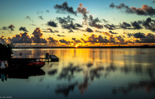 ocean new light sun reflection clouds sunrise island guinea boat harbour first symmetry beam png papua manus