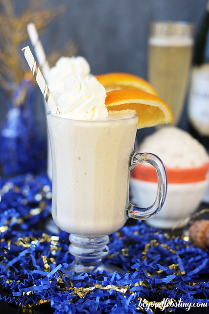 Mimosa Milkshake- A vanilla milkshake made with orange juice and champagne create a bubbly milkshake that will leave you wanting seconds. Serve them in a shot glass for the perfect New Year's Eve Dessert! 