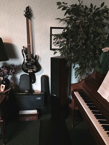 The tall item between piano and hanging guitar is one of our new speakers.