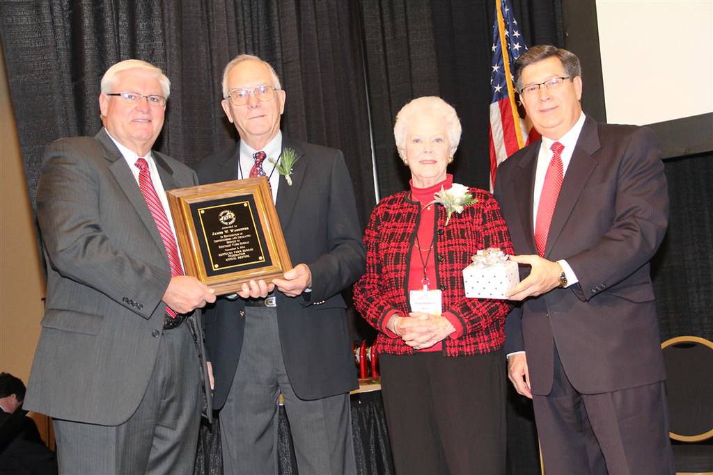 >Bill Waggener (center left) along with his wife (center right) received the 2014 Distinguished Service to Farm Bureau award at the organization