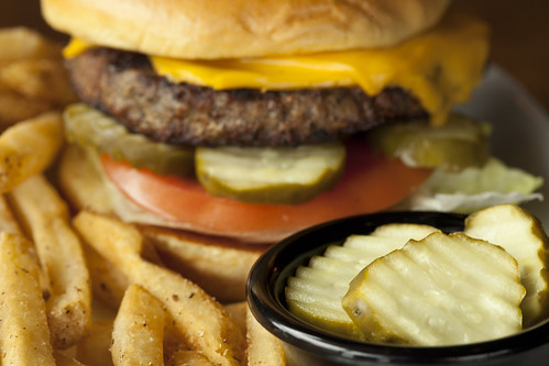 After the ARS Food Science Research Unit helped reduce the amount of spoilage in the pickle making business industry, pickles became so much less expensive that dill pickle slices became popular on burgers in restaurants everywhere.