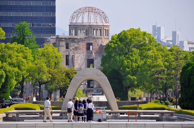 Students at memorial, with A-dome in background
