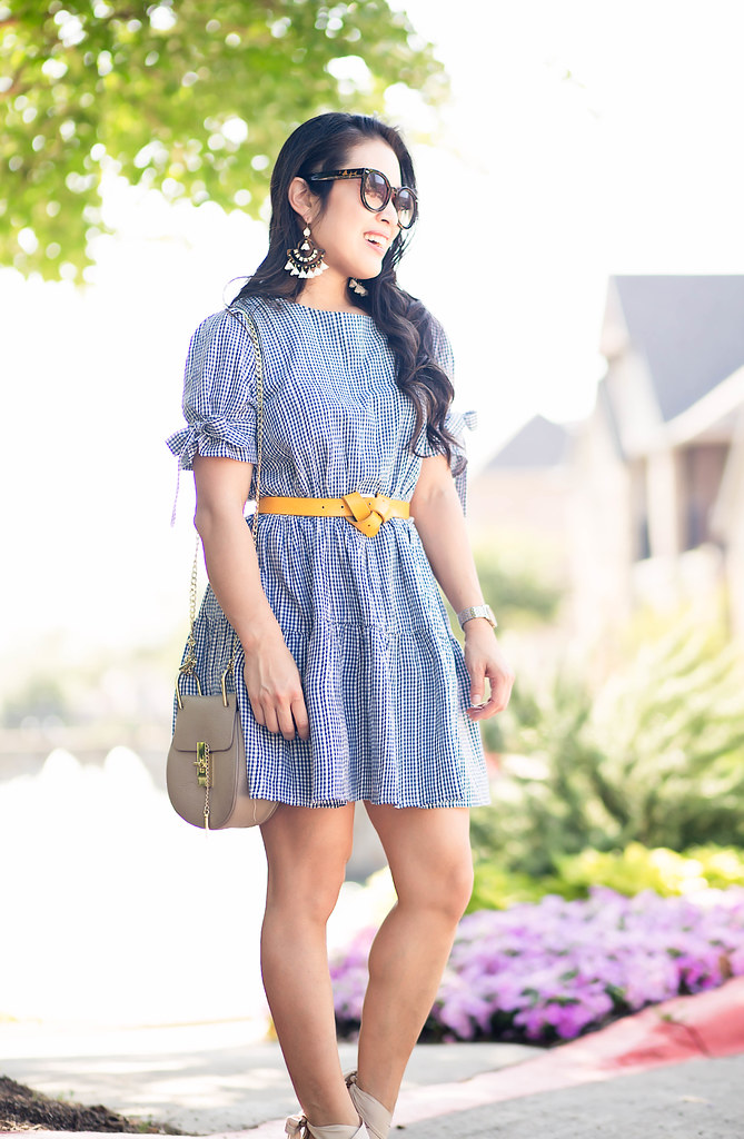 cute & little blog | petite fashion | blue gingham dress, yellow knotted belt, nude wedges, motty grey chloe drew, statement earrings | spring summer outfit