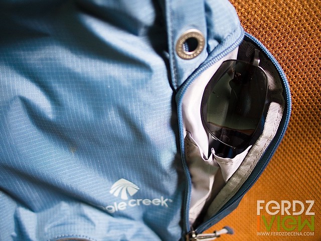 Zippered side pocket can fit sunglasses