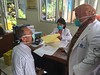 Dr Erlina Burhan speaks to Wistono, a driver and tuberculosis patient at the Persahabatan Hospital in Jakarta, Indonesia.