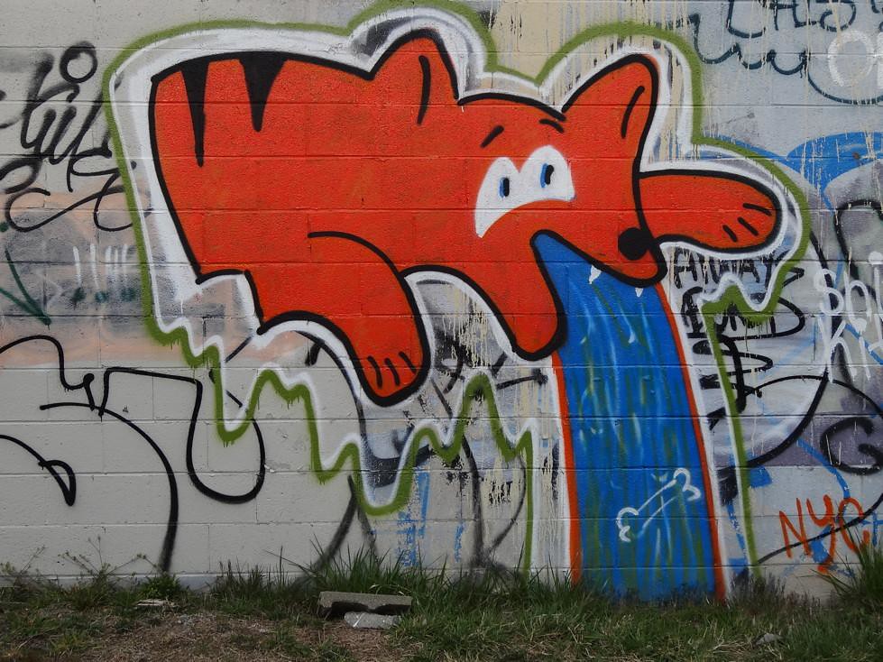 graffiti RAD Warehouses orange vomit