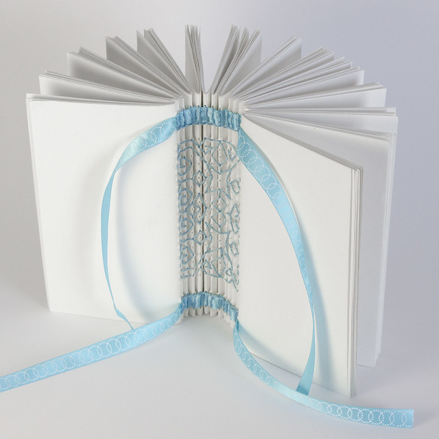 IMG_3493-White Book with Blue Ribbon on White Background