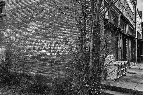 old bw building brick monochrome sign blackwhite store downtown texas unitedstates ad coke advertisement faded cocacola shiro