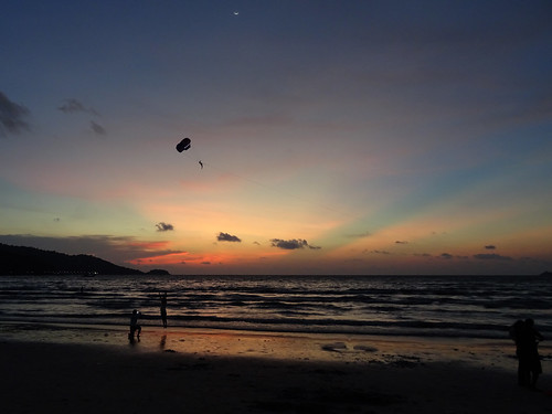 sunset silhouette jump phuket patong parasailing