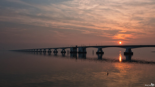 road bridge sunset sun holland netherlands clouds canon reflections evening zonsondergang widescreen nederland wolken zeeland brug avond 169 zon weg zierikzee pilars schouwenduiveland spiegeling 5km oosterschelde zeelandbrug pijlers canonef24105mm bracom 5022meter canoneos5dmkiii bramvanbroekhoven