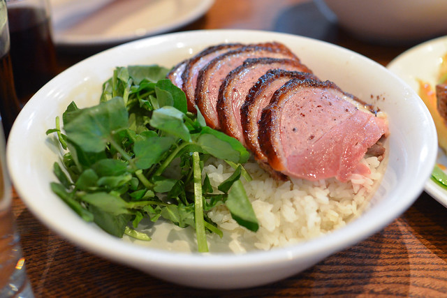 rotisserie duck over rice duck scallion, ssäm sauce, crispy shallot