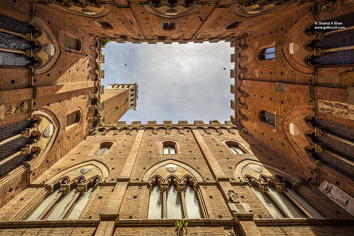 old travel sky italy building brick tower nature birds architecture del square high italian ancient looking view background interior sienna places arches medieval tuscany inside siena through shape palazzo palio mangia descriptivewords