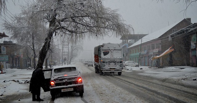 As it snows heavily, empty streets and stranded vehicles becomes a common feature across the valley. A deserted road bereft of pedestrians on the Jammu-Srinagar highway in Qazigund with small passenger vehicles stranded even as goods vehicles and trucks..