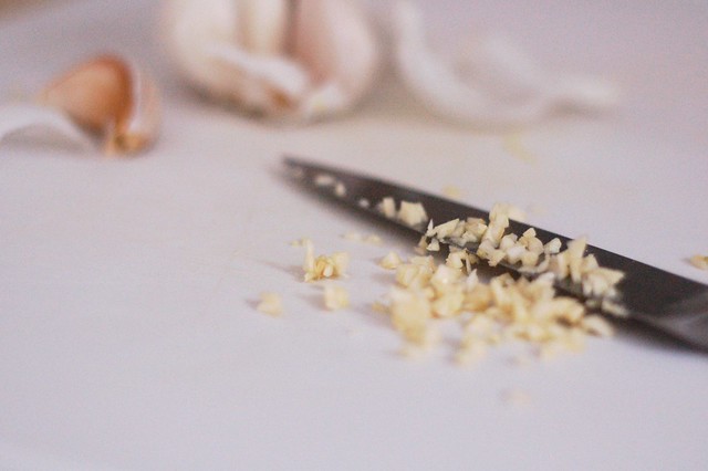 Chopping garlic by Eve Fox, The Garden of Eating, copyright 2015