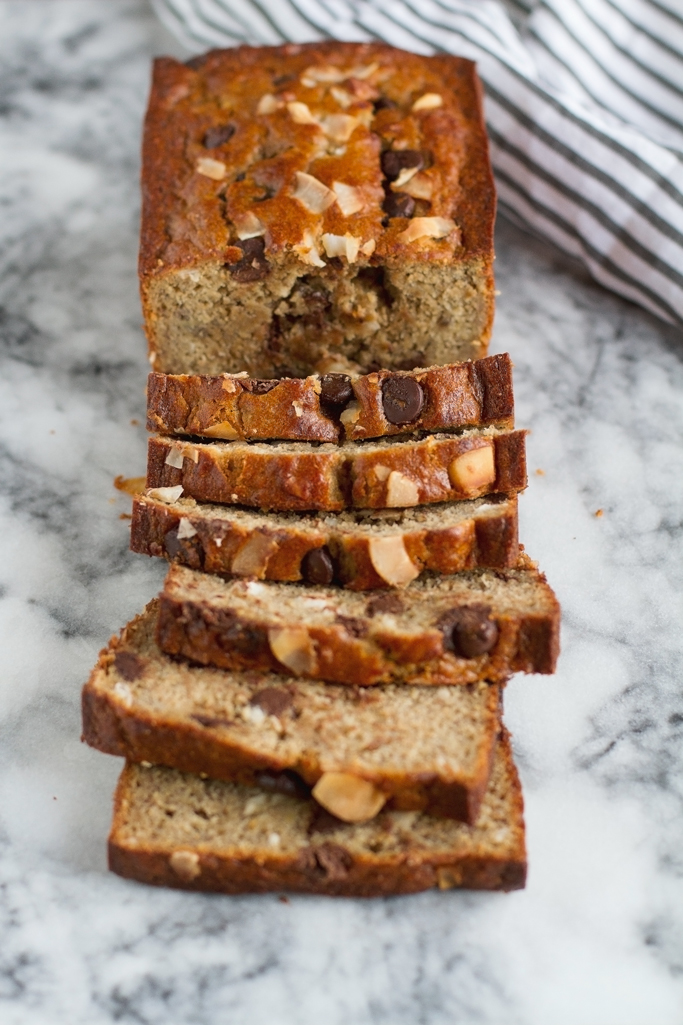 Coconut Chocolate Chip Banana Bread - Made with coconut oil, greek yogurt, and whole wheat flour. This bread is to DIE for! #bananabread #chocolatechip #bananamuffins | Littlespicejar.com
