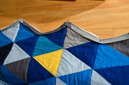 Quilt binding attached to right side of quilt.