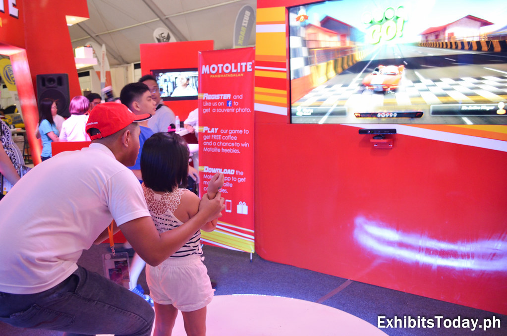 Video game play at the Motolite booth