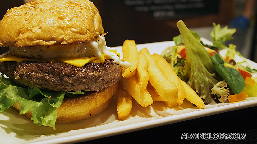 Burger Nowhere is a beef patty topped with sliced tomato, cheese, lettuce, caramelised onion and a sunny-side up. ($14.80)