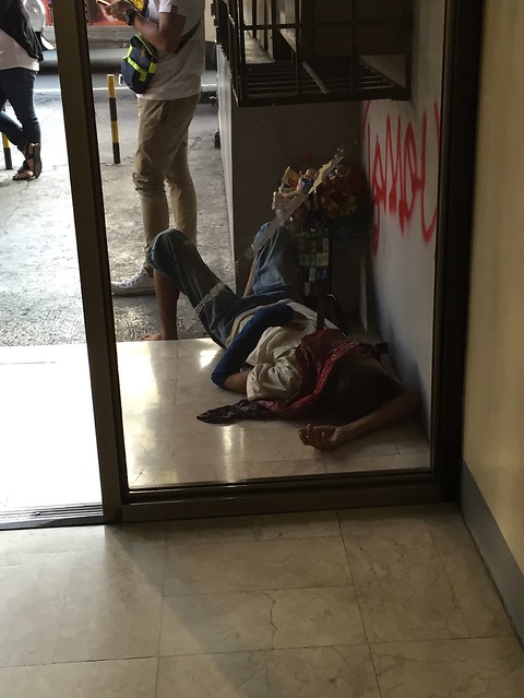 vendor sleeping on side walk