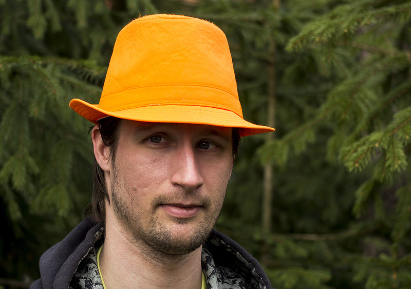 The Man With The Orange Hat
