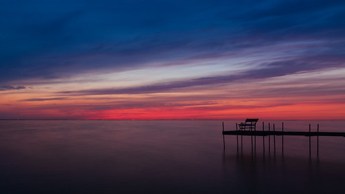 sunset wisconsin lakewinnebago midwest water pier bench colorful canoneosrebelt1i tamronaf1750mmf28xrdiiildasphericallens longexposure clouds johnwestrock