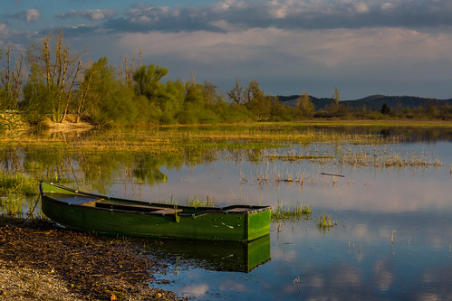 morning lake reflection water sunshine clouds sunrise boat slovenia slovenija karst intermittent cerknica