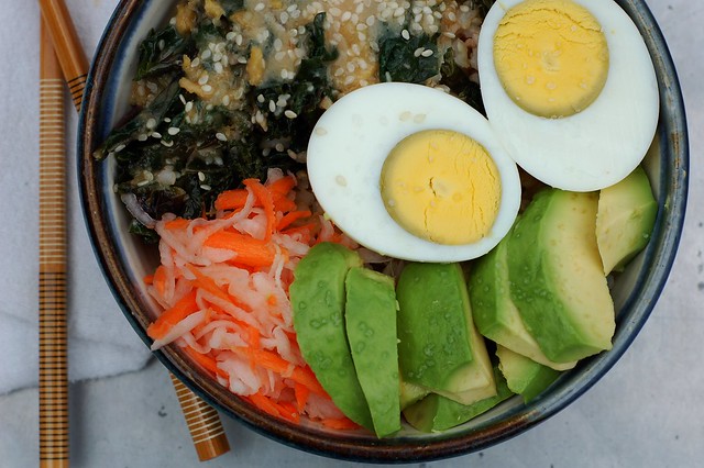 Warm rice bowl with ginger-tamari kale, avocado, pickled daikon and carrot, avocado and hard-boiled egg by Eve Fox, The Garden of Eating, copyright 2015