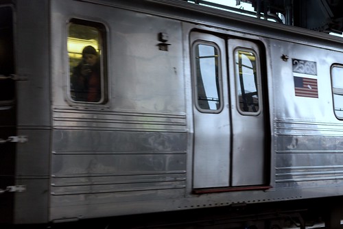 Woman on Phone on Subway Train