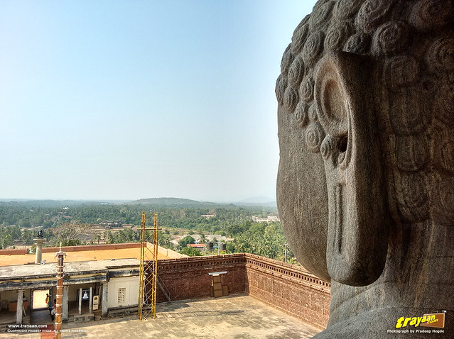 Lord Bahubali the Gommateshwara monolith looking towards the Chaturmukha Basadi in Karkala, Udupi district, Karnataka, India