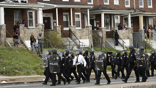 Police line marching toward protestors on Reisterstown Road, Baltimore