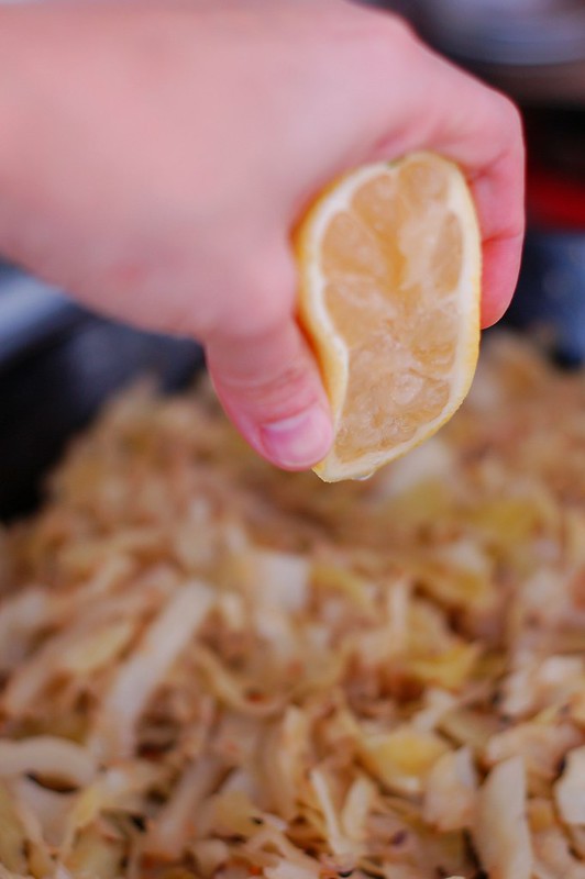 Squeezing lemon over the Indian-Spiced Braised Cabbage by Eve Fox, The Garden of Eating, copyright 2015