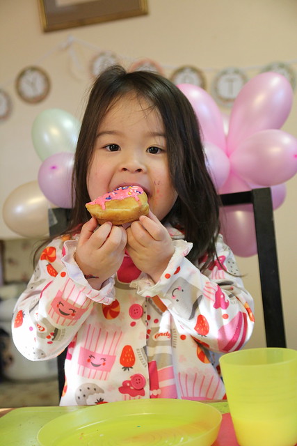 Loving her birthday donut!