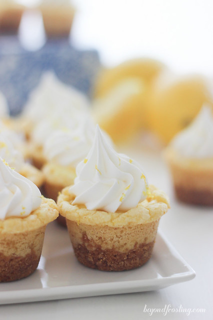 These Lemon Cream Pie Cookie Cups will knock your socks off. Full of lemon flavor, these cookie cups have an easy lemon mousse filling and topped with Fresh Whipped Cream. 