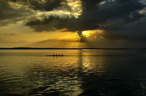 sunset sea reflection yellow clouds boat cuba cienfuegos rowers