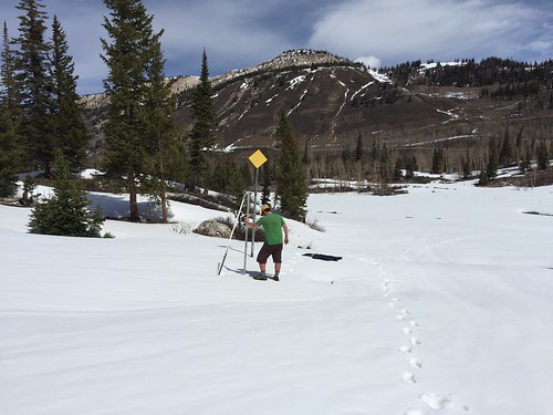 Utah Snow Surveyor Beau Uriona measuring snow