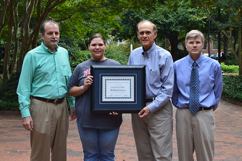 Brittany Lowery, a student at North Carolina State University, receiving her certificate of completion of Swine Science Online, from Dr. Todd See, Dr. Ken Esbenshade and Dr. Billy Flowers