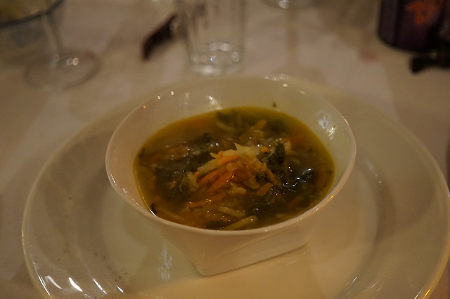 Golden vegetable soup with vegan matzoh balls