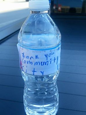 Water bottle that reads: “Thank you for being a part of our community and helping our city be a better place.”