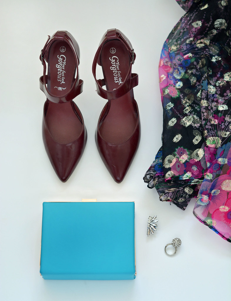 Burgundy pointed heels, blue clutch and patterned dress