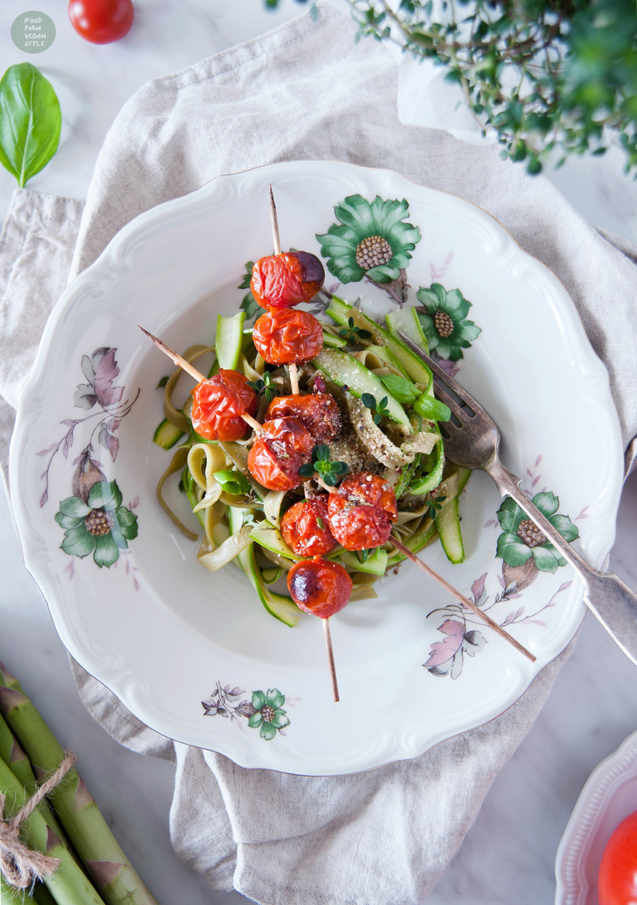 Green taglatelle with asparagus, grilled cherry tomatoes, lemon-thyme olive and vegan "parmesan"