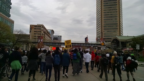 Protesters march past Harborplace and the Inner Harbor.