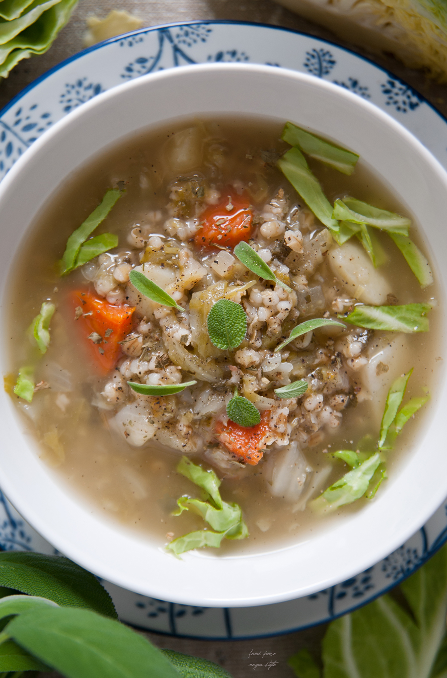 Young cabbage soup with pearl barley and sage