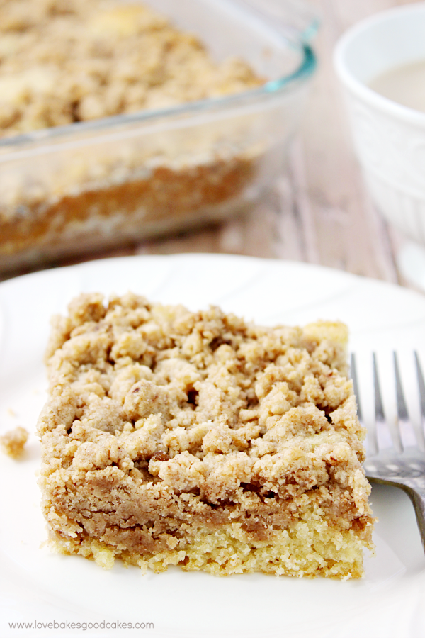 New York Crumb Cake on a plate with a fork.