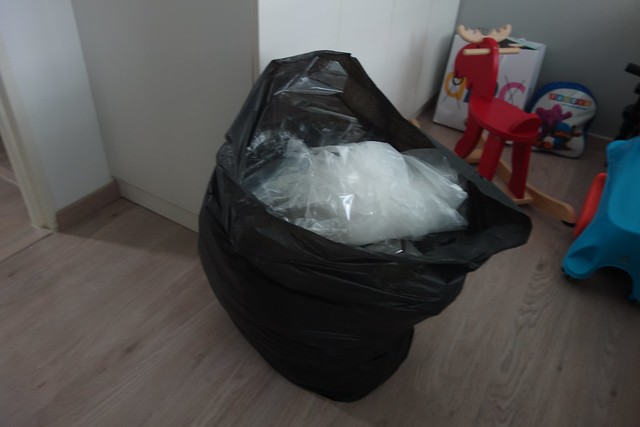 Trash bags. They throw as they work, making minimal mess. 