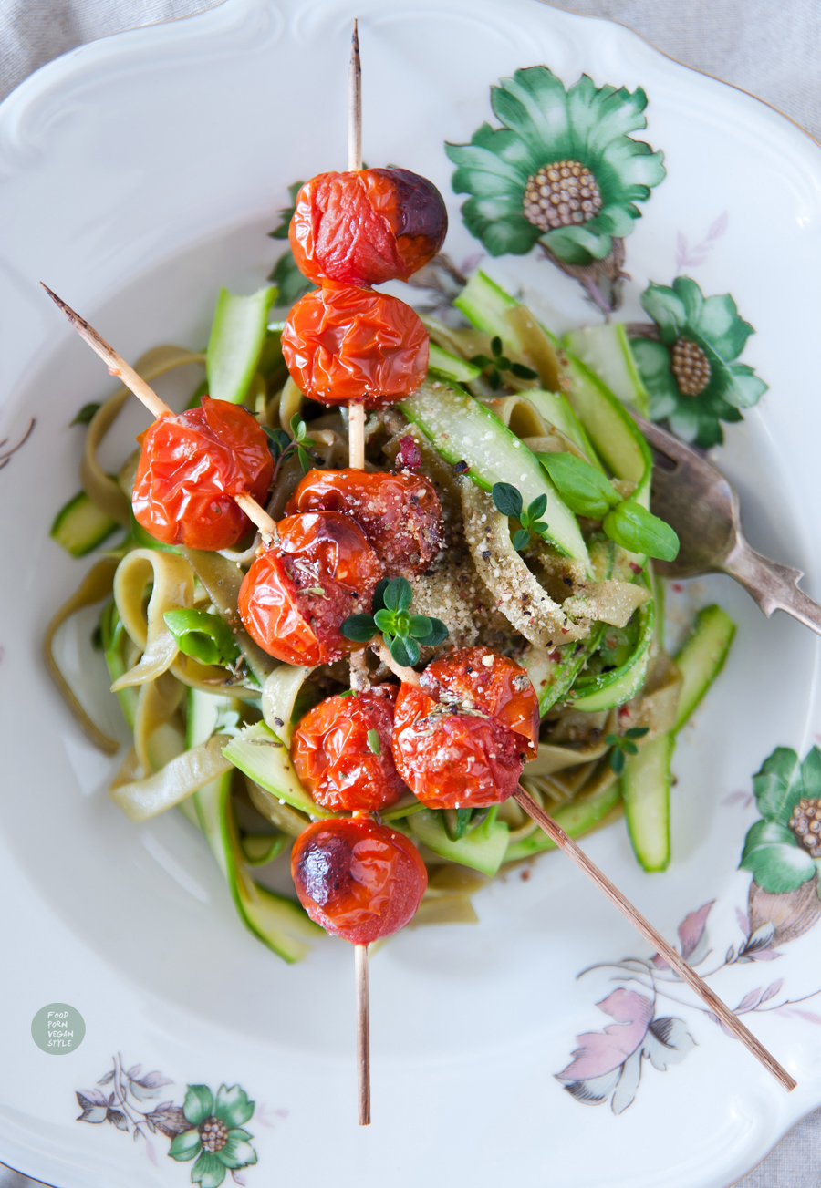 Green taglatelle with asparagus, grilled cherry tomatoes, lemon-thyme olive and vegan "parmesan"