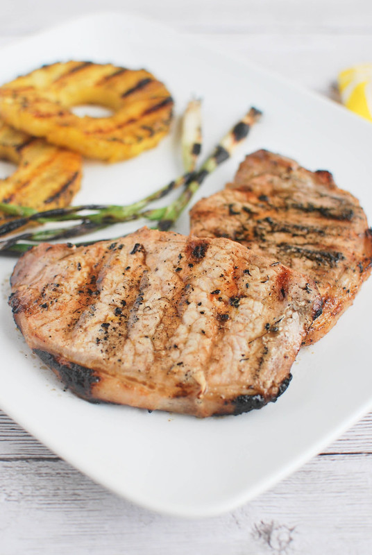 Grilled Ginger-Sesame Pork Chops with Pineapple and Scallions - pork chops marinated in a ginger sesame citrus marinade and grilled with pineapple and green onions. 
