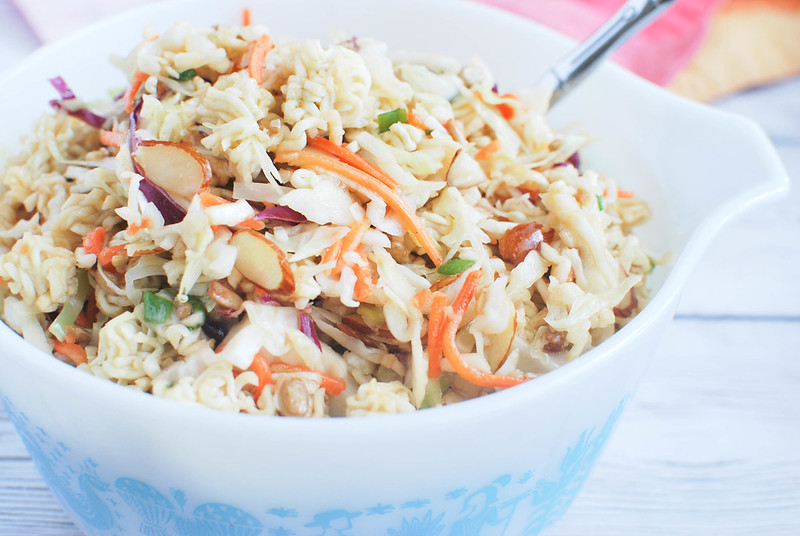 Ramen Noodle Salad - cole slaw mix, almonds, sunflower seeds, and ramen noodles in a sweet and tangy dressing. Perfect summer side dish for parties and barbecues!